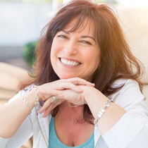 woman smiling with All-on-4 in Astoria