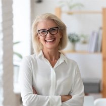 Woman with dentures in Astoria 