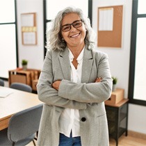 Woman at work wearing dentures in Astoria  