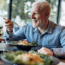 Man eating a chicken salad