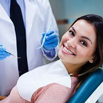 Woman smiling after tooth extraction in Astoria