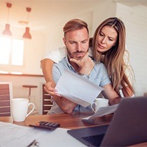 couple looking over paperwork together 