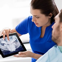 Male patient looking at his dental X-rays