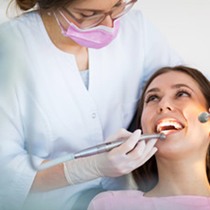 Woman getting an oral cancer screening