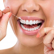 close-up of a person flossing 