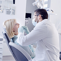 Dentist treating patient