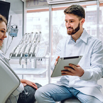 Woman at dentist for teeth whitening in Astoria