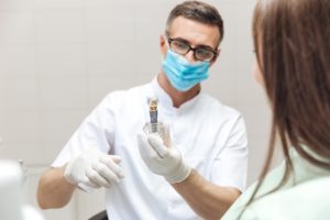 Dentist discussing dental implant with patient