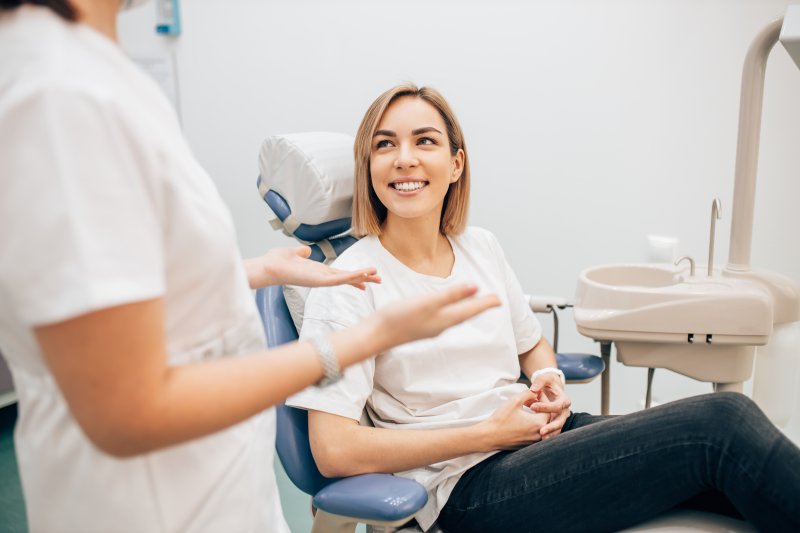 Lady smiles at dentist