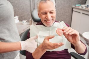 Man receiving his dentures